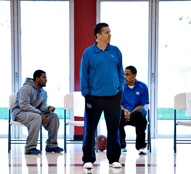 Kentucky basketball coach John Calipari (standing) will wear a microphone as he runs a Wildcats practice on ESPNU today at 3 p.m. ET. Also pictured above: former staff members Brandon Weems (left) and Rod Strickland. (Joe Faraoni/ESPN Images)