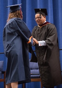 Mike Tirico participates in the commencement ceremony at Syracuse University. (Photo credit: Syracuse University)