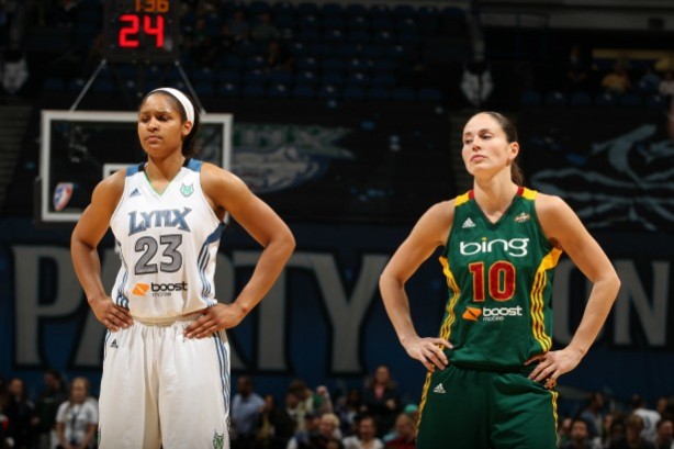 Seattle's Sue Bird (right), seen here next to Minnesota's Maya Moore,  joins ESPN as a WNBA analyst this season as she recuperates from an injury. (David Sherman/NBAE via Getty Images) 