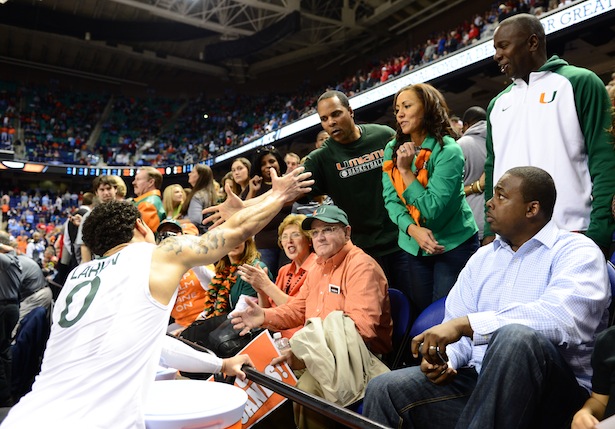 Shane Larkin shakes his father, Barry Larkin's hand during the 2013 ACC Tournament. (Phil Ellsworth/ESPN Images)