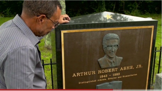 Johnnie Ashe stands by his brother Arthur's grave in this scene from the film. (ESPN)