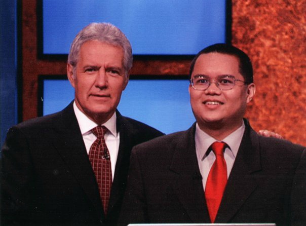 James Quintong (r) is an ESPN.com editor. In 2005, he won an episode of Jeopardy! hosted by Alex Trebek (l). (Photo courtesy James Quintong)
