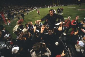 ORIGINAL CAPTION Head Coach Tom Flores of the Los Angeles Raiders gets carried off the field after they defeated the Washington Redskins 38-9 in Super Bowl XVIII  on January 22, 1984 at Tampa Stadium in Tampa, Florida. (Photo courtesy of Focus on Sport/Getty Images) 