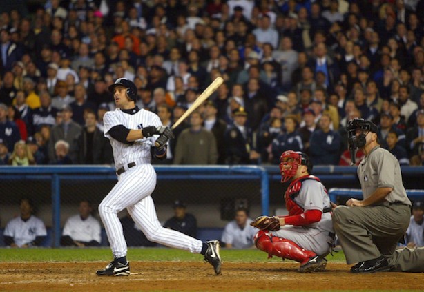 Aaron Boone hits the game winning home run against the Boston Red Sox during game 7 of the American League Championship Series in 2003. (Photo courtesy of Al Bello/Getty Images)