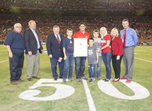 Tedy Bruschi with his family and University of Arizona officials during ceremonies honoring the former Wildcat. (Photo courtesy of Arizona Athletics)