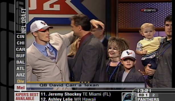From April 2002 at the NFL Draft: David Carr (far left) celebrates with his family after being picked No. 1 overall by the Houston Texans. Little brother Derek (third from right, white cap) is now a 2014 NFL Draft prospect.  (ESPN)