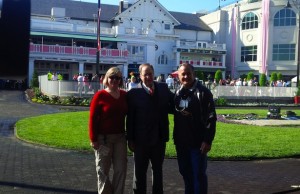 Kristine Kugler at this year’s Kentucky Oaks day with Hank Goldberg and photographer Rick Mickler. (Photo courtesy of Kristine Kugler)