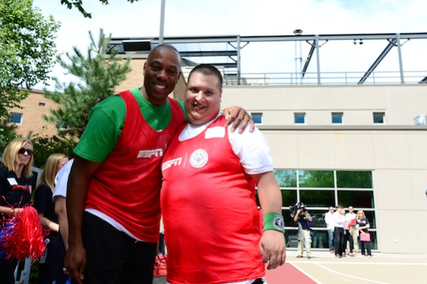 Jay Harris (l) with an athlete during a Special Olympics football game at ESPN's Bristol campus. (Joe Faraoni/ESPN Images)