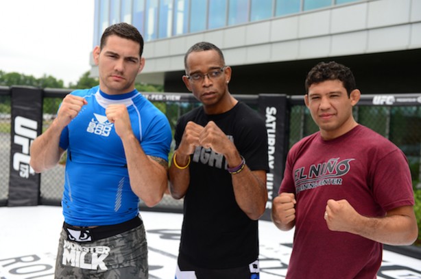 MMA fighter Chris Weidman (l), Stuart Scott and Gilbert Melendez in the UFC Octagon ring. (Joe Faraoni / ESPN Images)