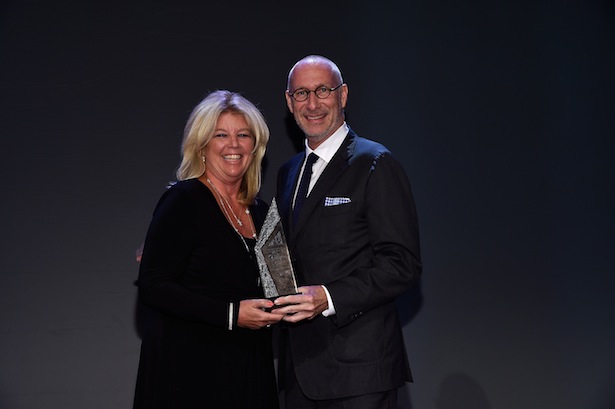 Chief Financial Officer ESPN Christine Driessen accepts the WICT Woman of the Year Award from President of ESPN Inc. and co-chairman of Disney Media Networks John Skipper at the 2014 Women in Cable Telecommunications Touchstones Luncheon on September 15, 2014 in New York City.  (Photo by Larry Busacca/Getty Images for Women in Cable Telecommunications)