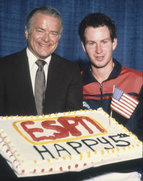 (caption to pic: Someone had given McEnroe, now a tennis analyst for ESPN, the American flag after his match. It was his idea to put it in the cake.)(Credit: Russ Adams)