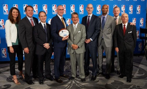 (L-R) ESPN executives Julie Sobieski, Burke Magnus, John Kosner, and President John Skipper (holding ball); NBA owner Ted Leonsis and Commissioner Adam Silver; ESPN executives Doug White, Sean Bratches and Ed Durso at the announcement of the new extension of partnerships between ESPN and the NBA.  (Rich Arden/ESPN Images)